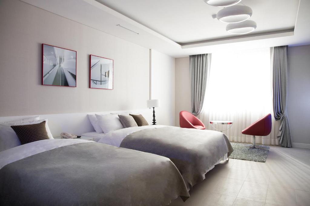 Postel nebo postele na pokoji v ubytování Hotel Mate Bundang