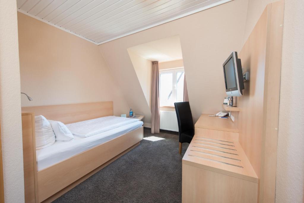 Postel nebo postele na pokoji v ubytování Hotel Am Alten Strom