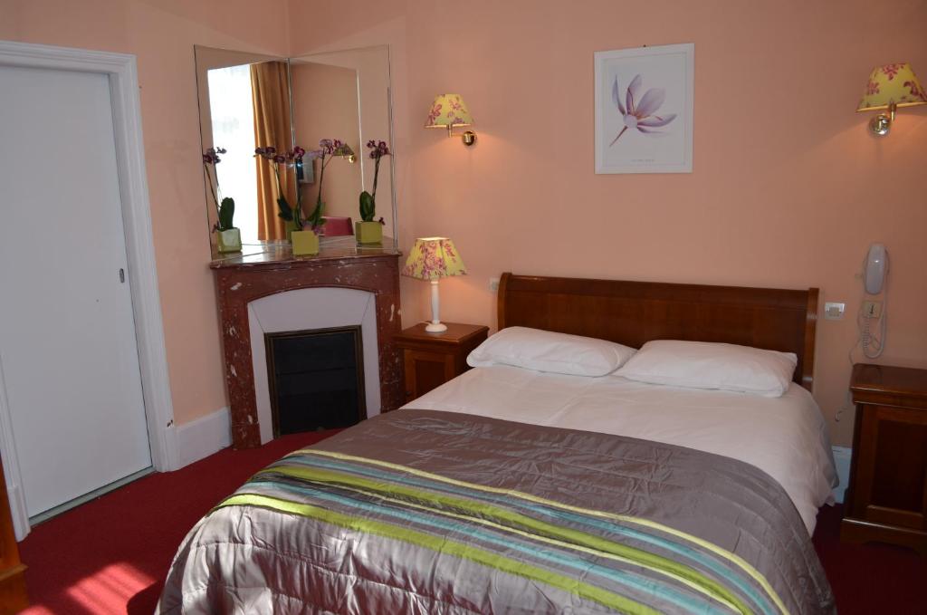 Postel nebo postele na pokoji v ubytování Hotel LE BEAU SITE
