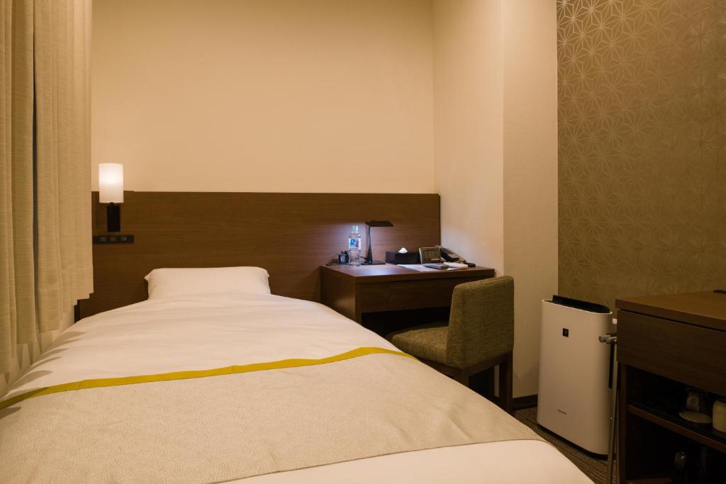Tosei Hotel Cocone Ueno房間的床
