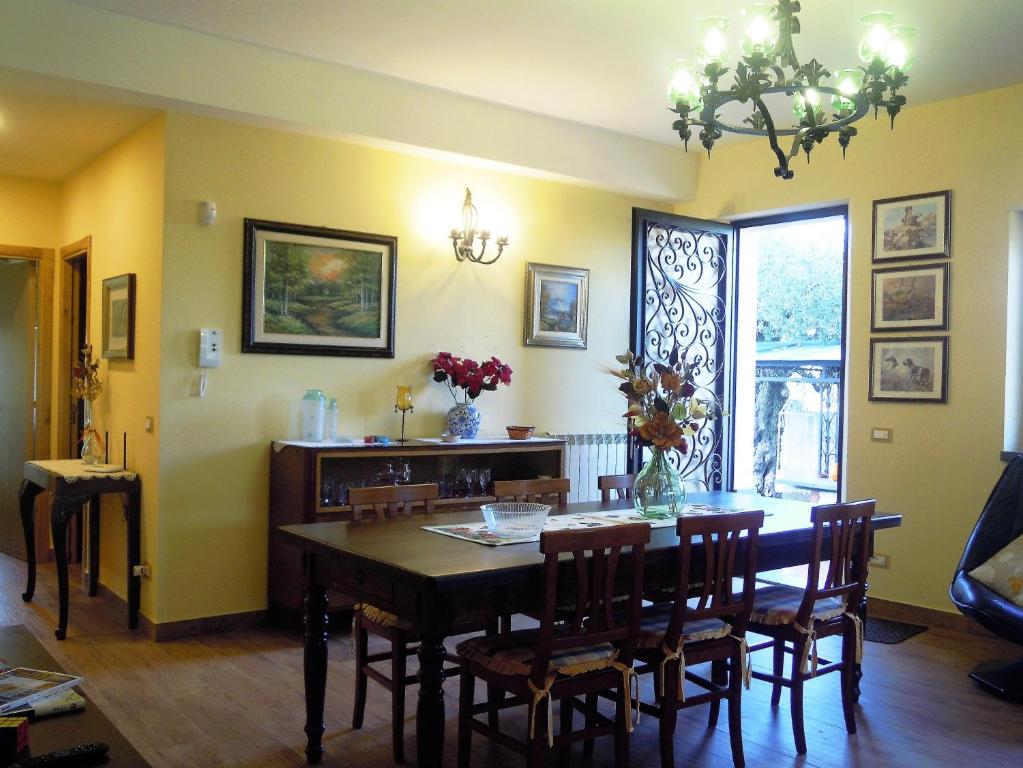 a dining room with a table and chairs at La Tavernetta in Randazzo