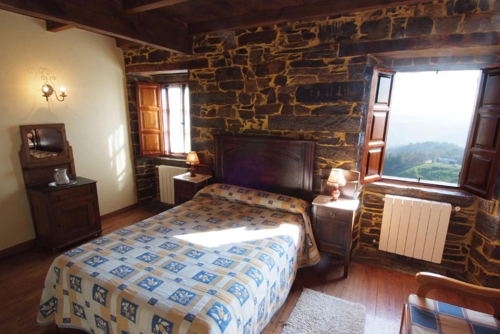 Postel nebo postele na pokoji v ubytování Apartamentos rurales Casa Do Cabo