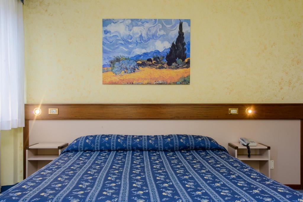Postel nebo postele na pokoji v ubytování Bes Hotel Papa San Pellegrino Terme