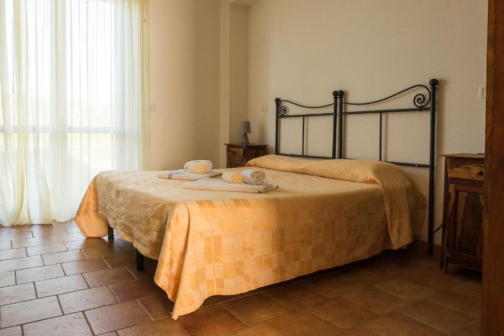 Postel nebo postele na pokoji v ubytování Villaggio Le Querce