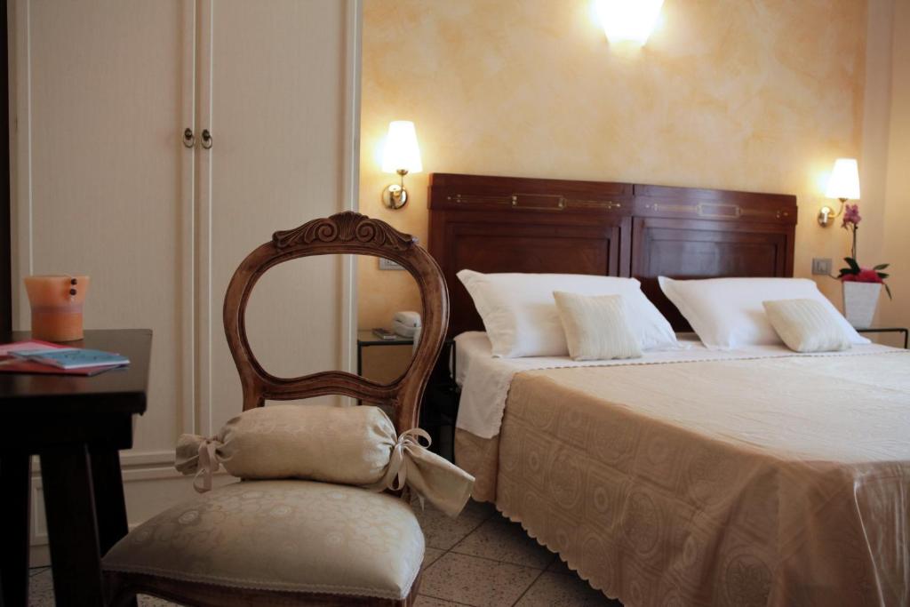 Postel nebo postele na pokoji v ubytování Hotel b&b Villa Irma