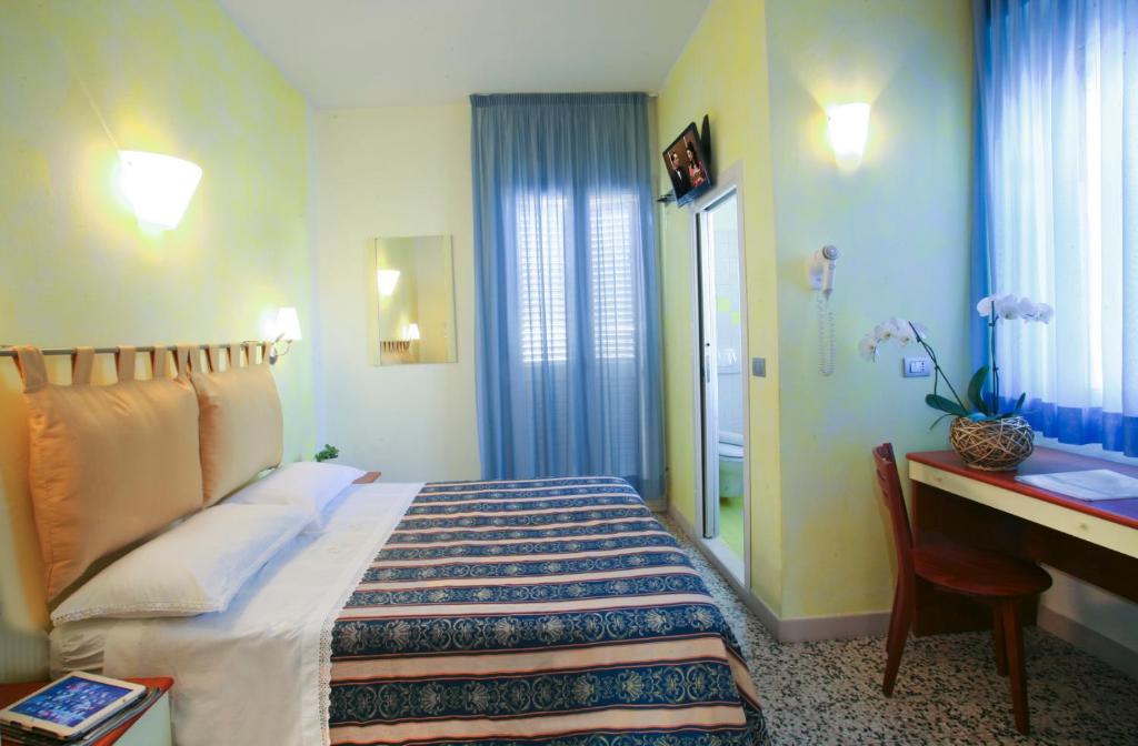 Postel nebo postele na pokoji v ubytování Hotel b&b Villa Irma