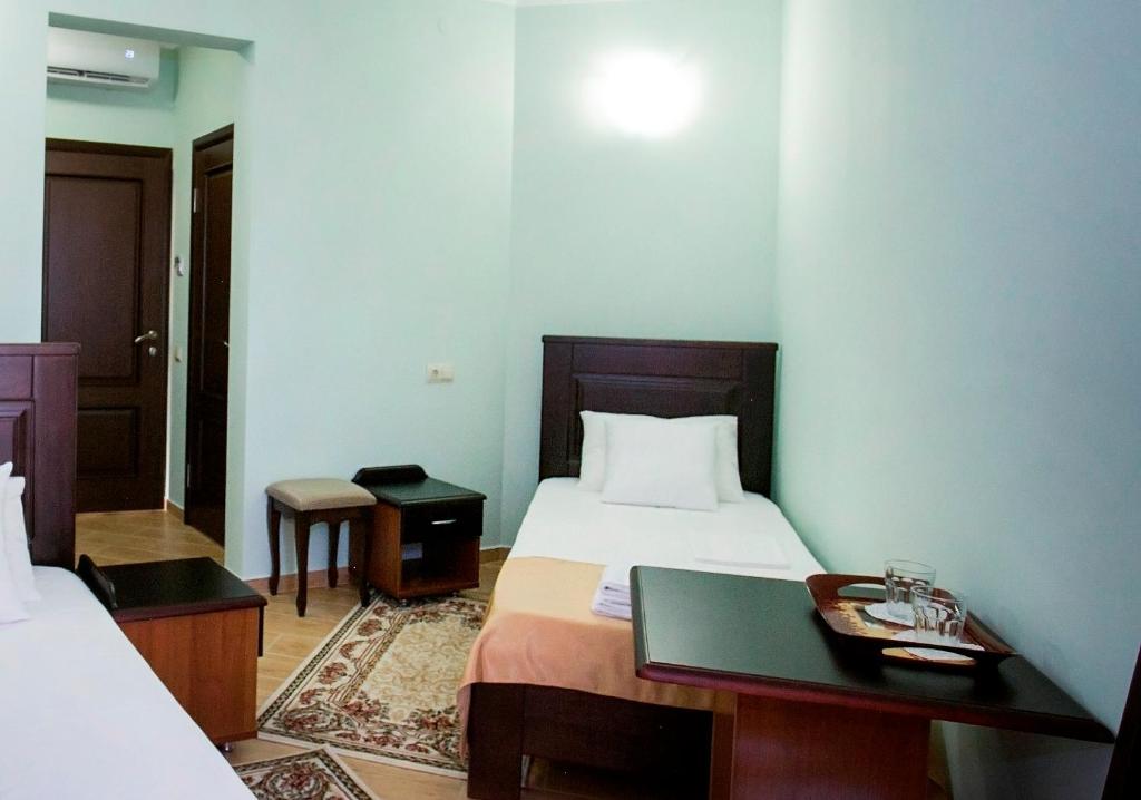 Postel nebo postele na pokoji v ubytování Hotel ACRA