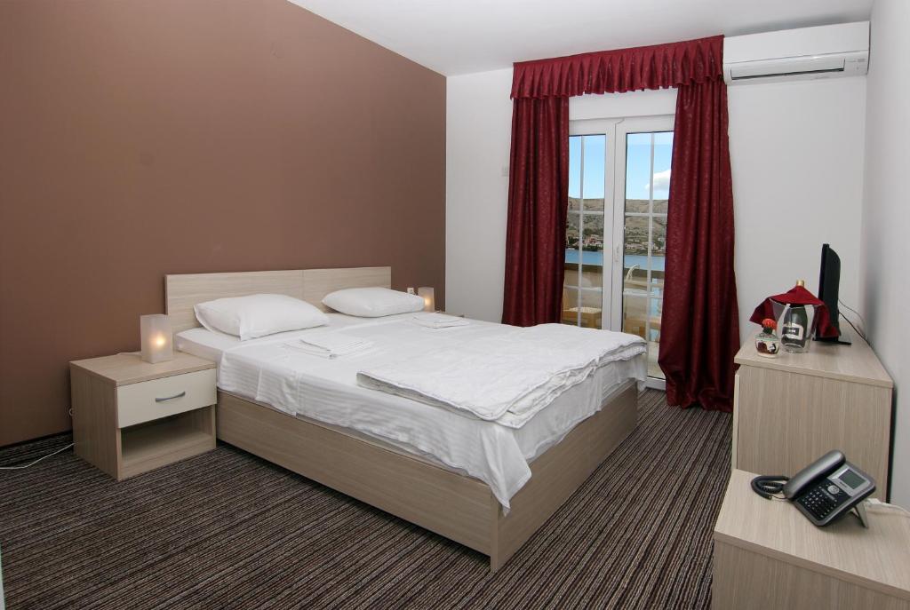 Postel nebo postele na pokoji v ubytování Hotel Belveder