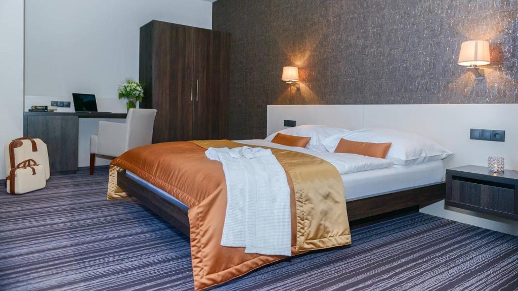 Postel nebo postele na pokoji v ubytování Horizont Resort