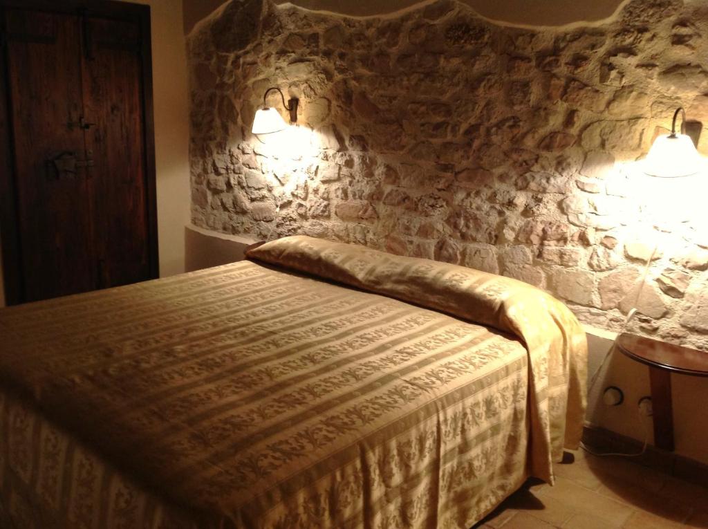 Postel nebo postele na pokoji v ubytování Antico Casale Urbani