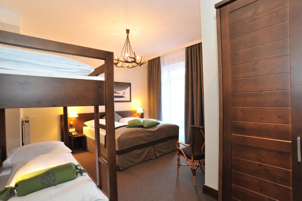 Postel nebo postele na pokoji v ubytování Ski Lodge Reineke