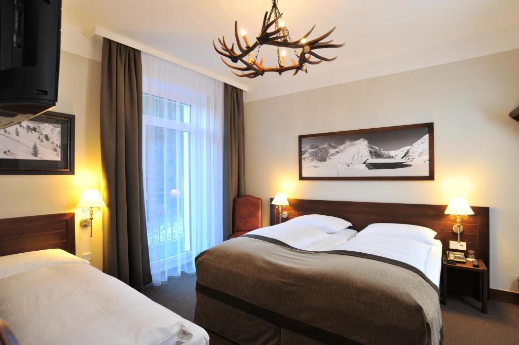 Postel nebo postele na pokoji v ubytování Ski Lodge Reineke