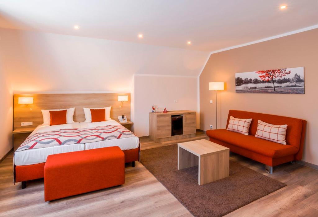 Postel nebo postele na pokoji v ubytování das seidl - Hotel & Tagung - München West