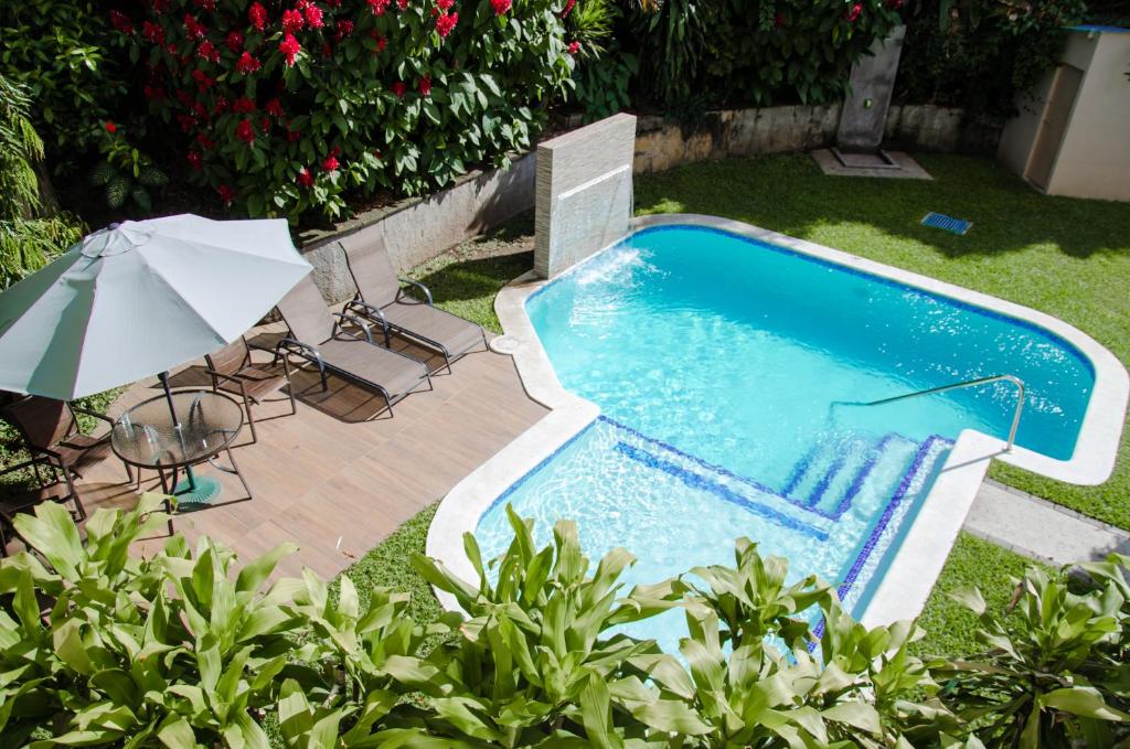 Πισίνα στο ή κοντά στο Hotel Gardenia Inn