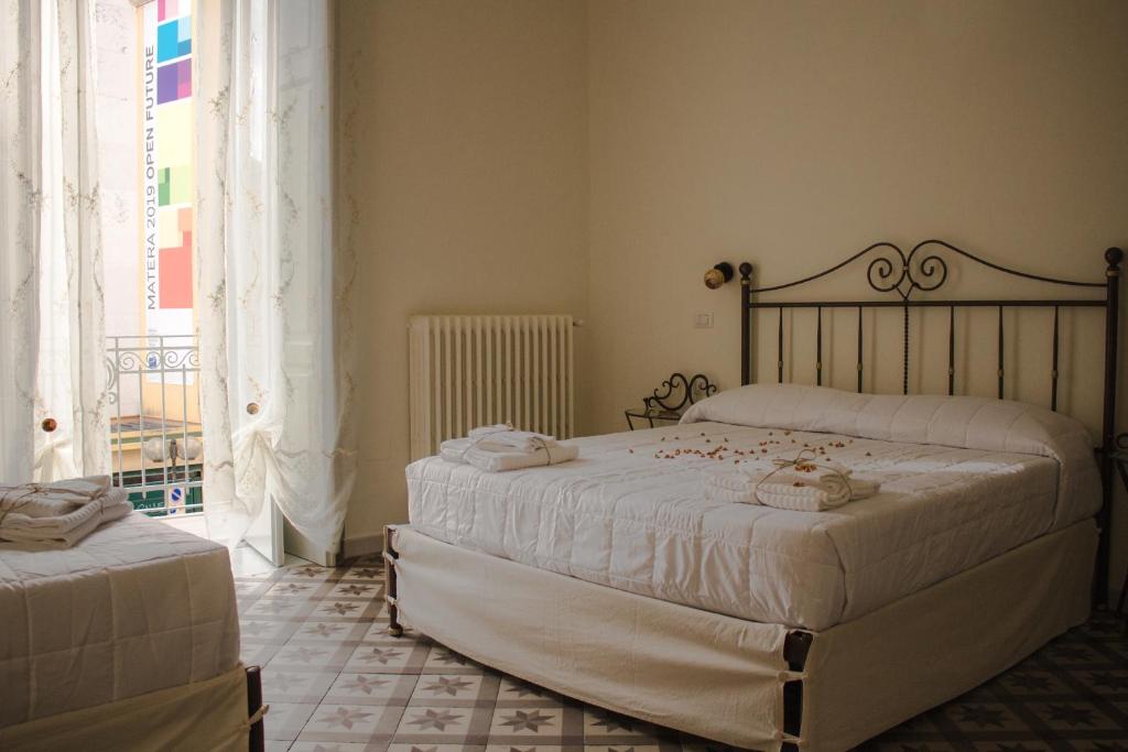 Postel nebo postele na pokoji v ubytování Pietre e Sassi