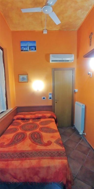 Postel nebo postele na pokoji v ubytování Porto Recanati Zimmer