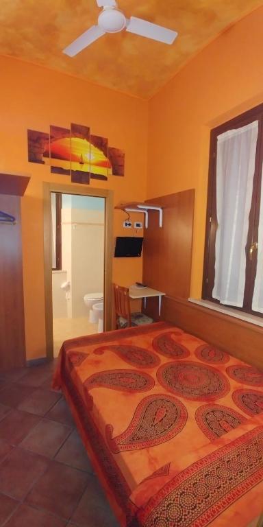 Postel nebo postele na pokoji v ubytování Porto Recanati Zimmer
