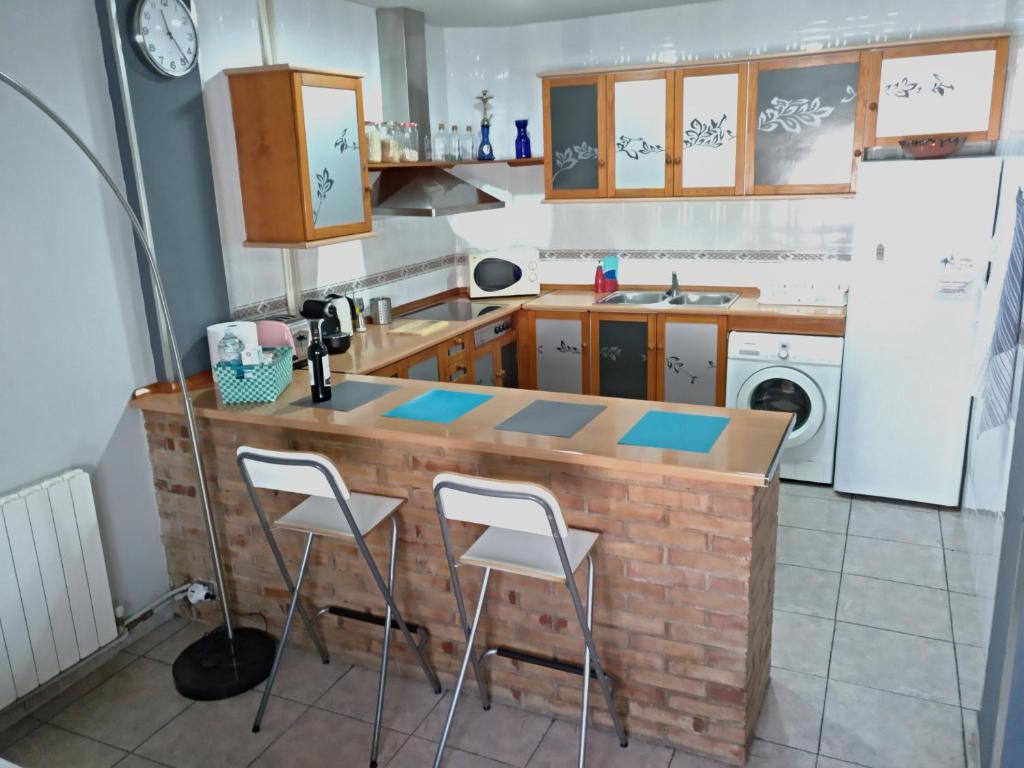 Kuchyň nebo kuchyňský kout v ubytování Piso La Torre