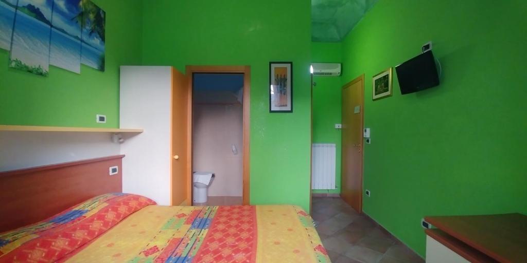 Postel nebo postele na pokoji v ubytování Porto Recanati Zimmer