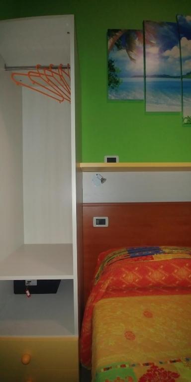 Postel nebo postele na pokoji v ubytování Porto Recanati Zimmer