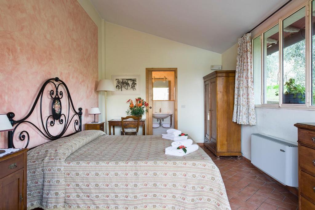Postel nebo postele na pokoji v ubytování B&B Ponte a Nappo San Gimignano