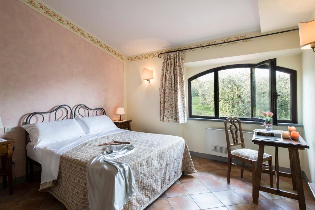 Postel nebo postele na pokoji v ubytování B&B Ponte a Nappo San Gimignano