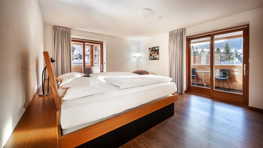 Postel nebo postele na pokoji v ubytování Ciasa de Munt Lifestyle Living