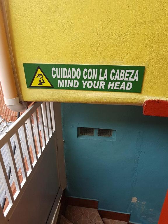 a sign on the side of a building at Hotel Posada Tayazal in Flores