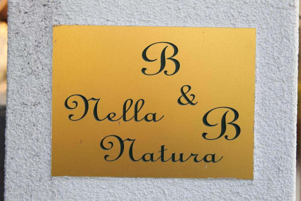 ポルデノーネにあるAppartamento " Nella Natura "の国民の挨拶の看板
