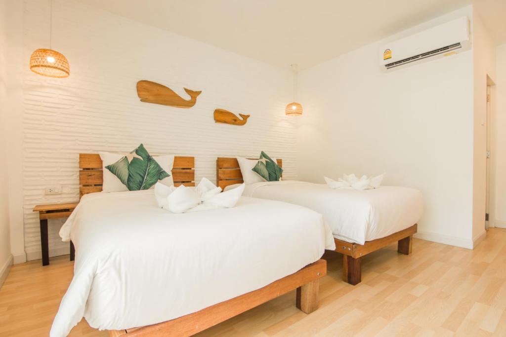 Postel nebo postele na pokoji v ubytování Whalecome Aonang Resort-SHA Extra Plus