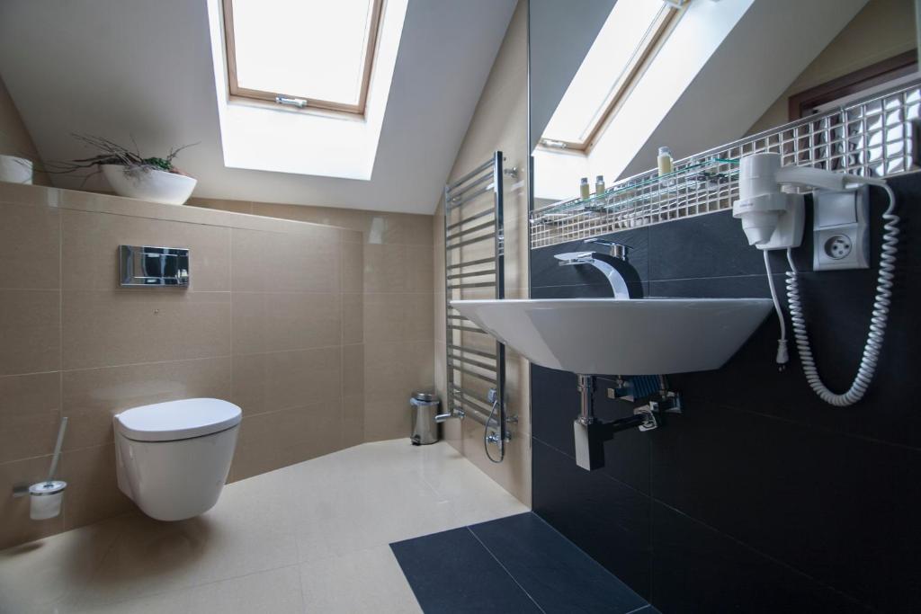 Baðherbergi á Hotel Krušnohorský Dvůr