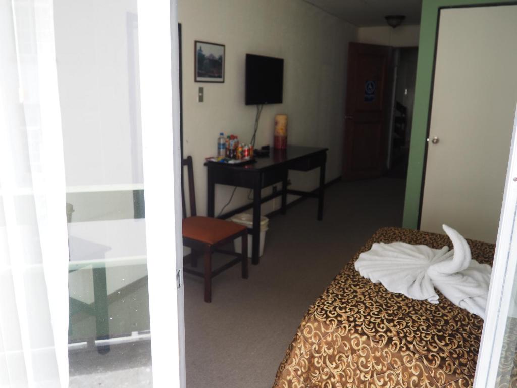 Postel nebo postele na pokoji v ubytování Nuevo Maragato Hotel & Hostel