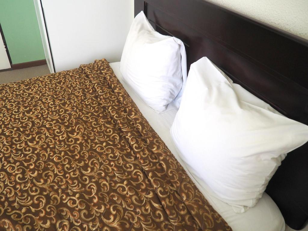 Postel nebo postele na pokoji v ubytování Nuevo Maragato Hotel & Hostel