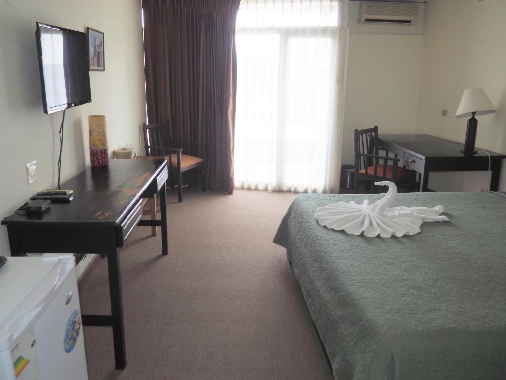 Postel nebo postele na pokoji v ubytování Nuevo Maragato Hotel & Hostel