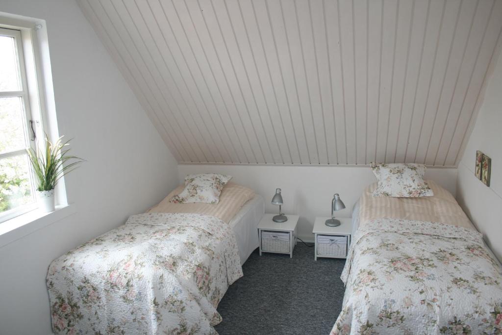 Postel nebo postele na pokoji v ubytování Hotel Ærøhus