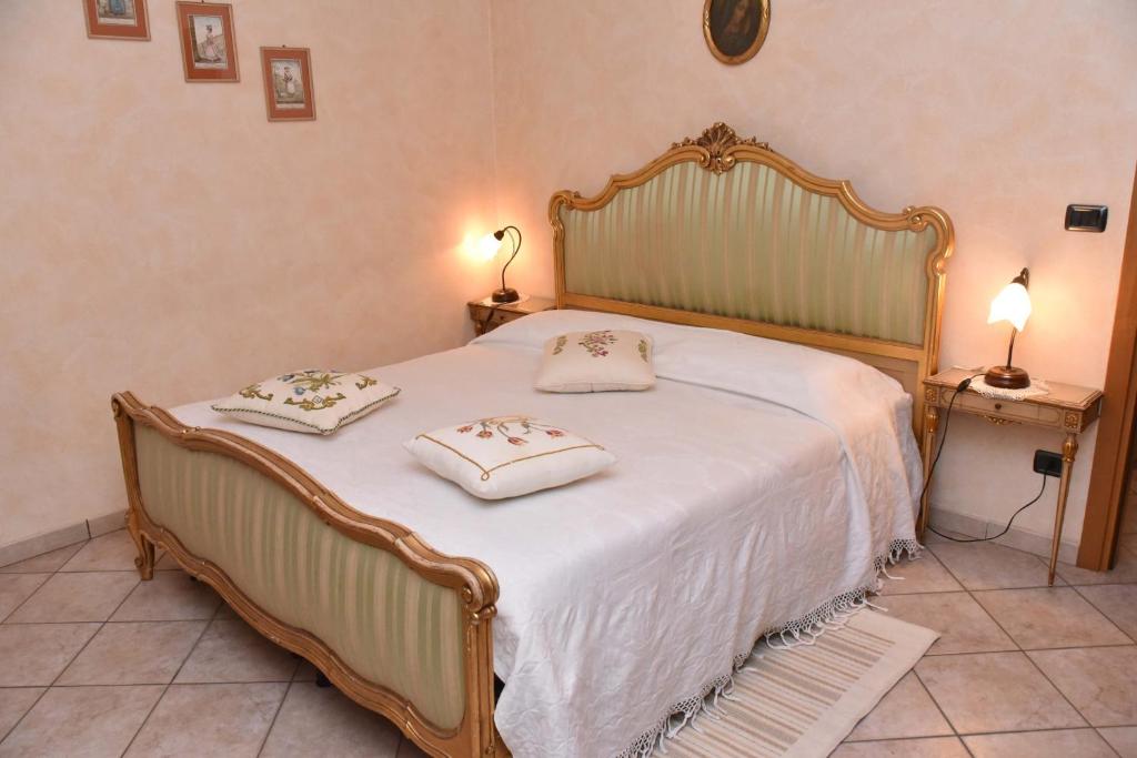 Postel nebo postele na pokoji v ubytování Agriturismo La Ca 'd Majin