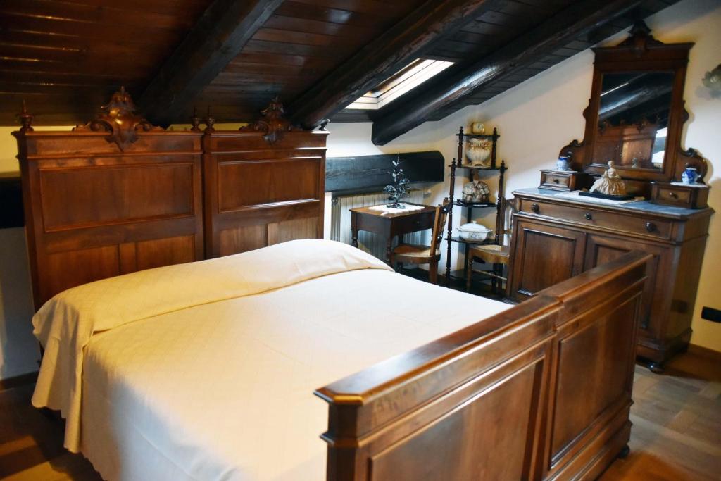 Postel nebo postele na pokoji v ubytování Agriturismo La Ca 'd Majin