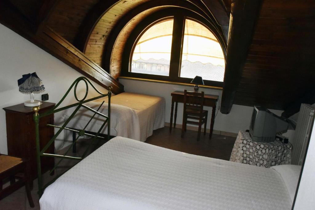 Postel nebo postele na pokoji v ubytování Agriturismo La Ca 'd Majin