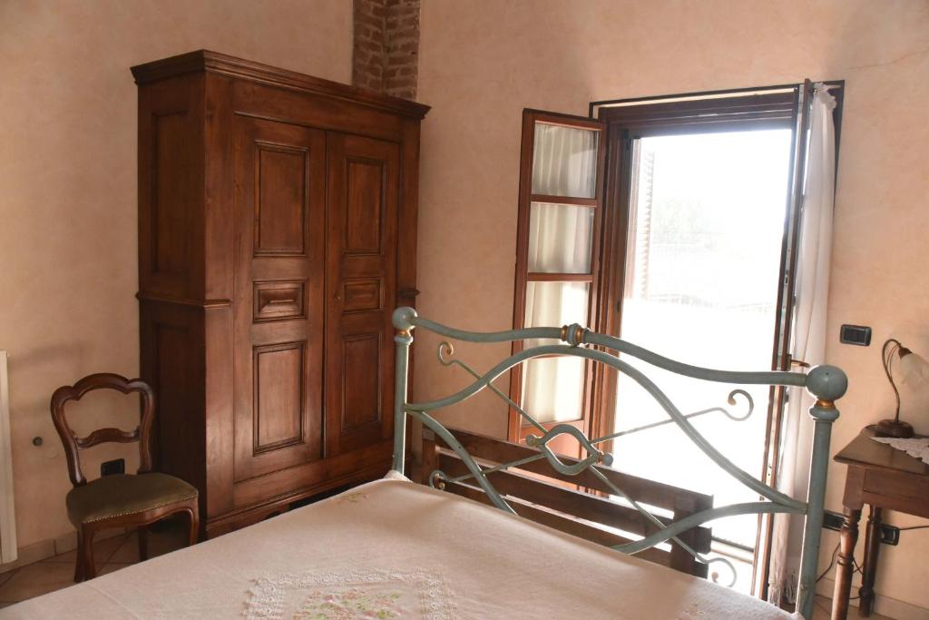 Postel nebo postele na pokoji v ubytování Agriturismo La Ca 'd Majin