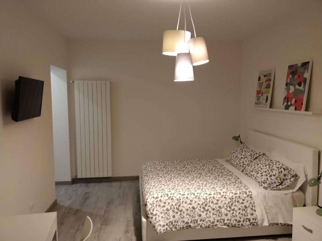Łóżko lub łóżka w pokoju w obiekcie Novantatrè