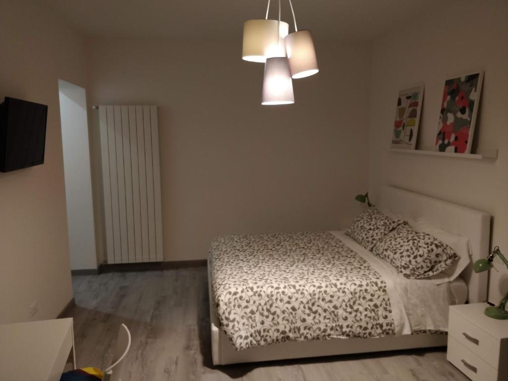 Łóżko lub łóżka w pokoju w obiekcie Novantatrè