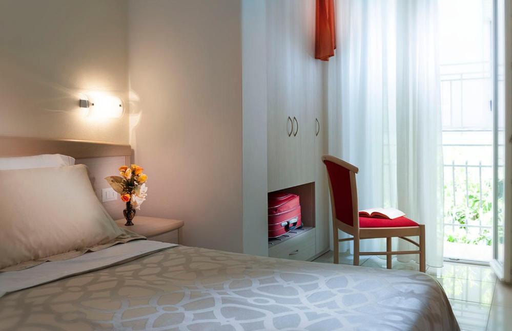 Postel nebo postele na pokoji v ubytování Hotel Ada