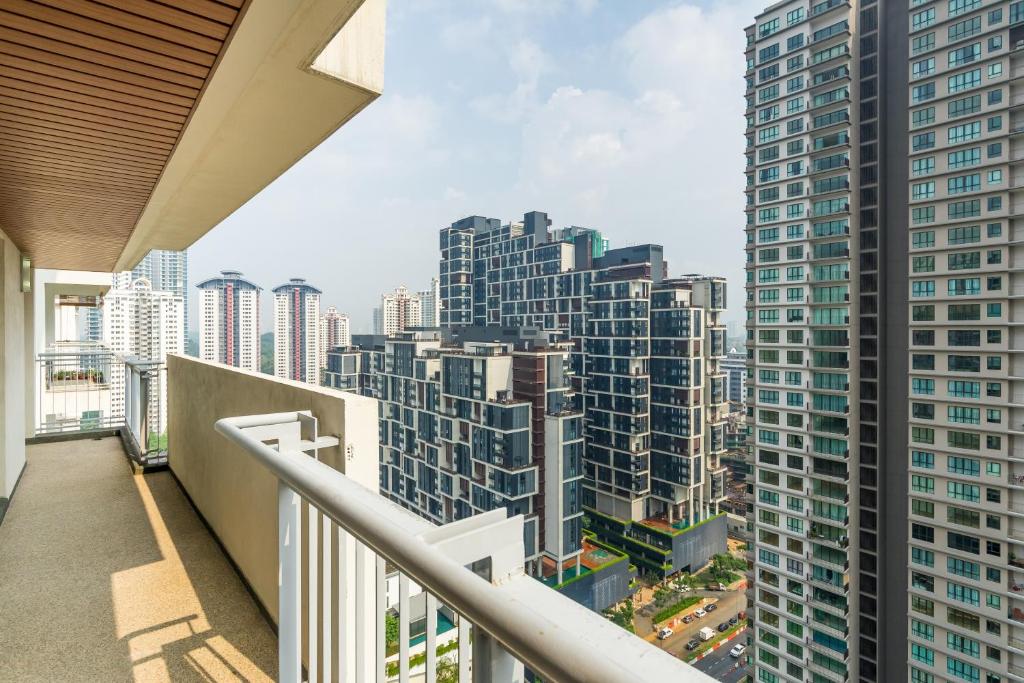 a balcony with a view of tall buildings at Luxury Kiara in Kuala Lumpur