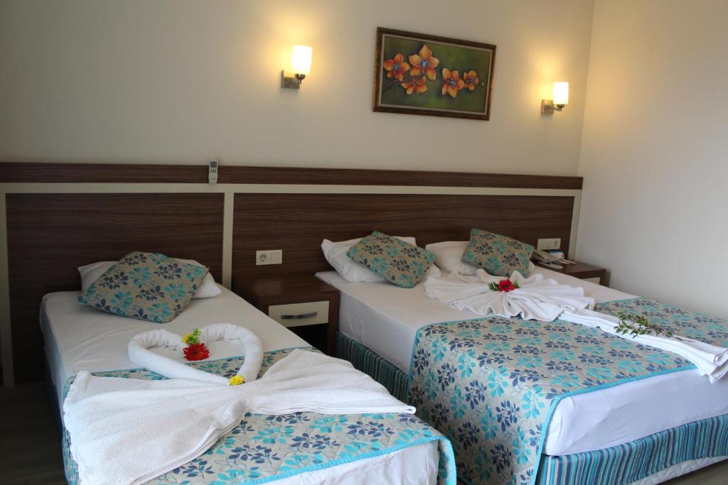 Postel nebo postele na pokoji v ubytování Side West Park Hotel