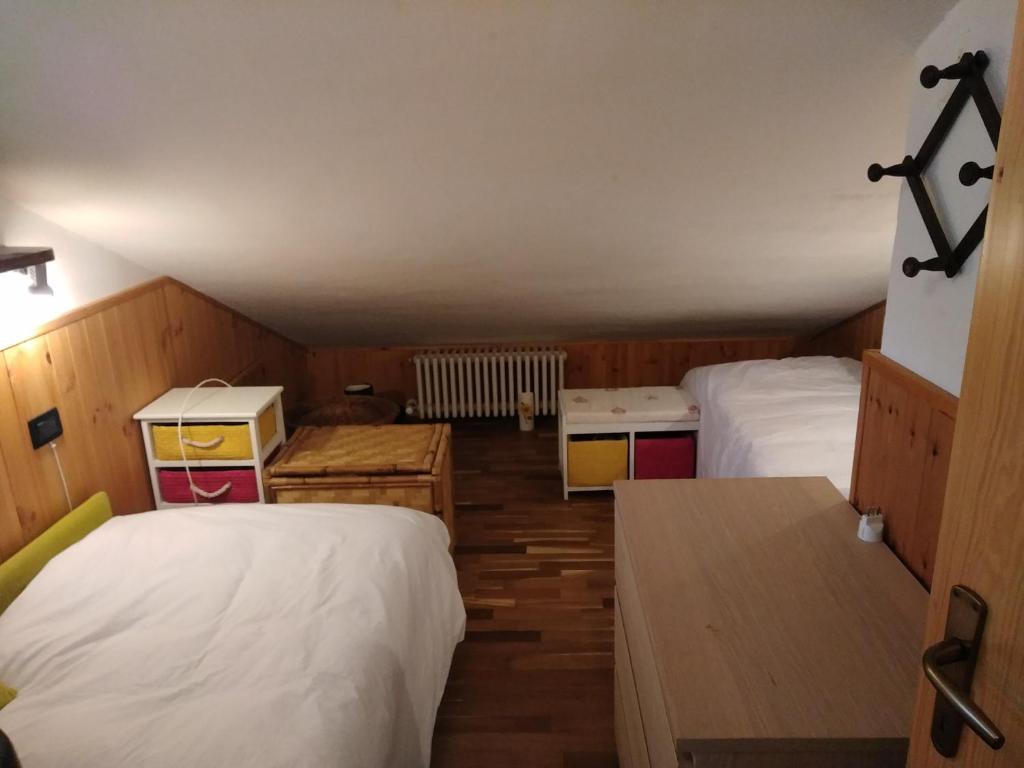 Łóżko lub łóżka w pokoju w obiekcie Condominio Esagono