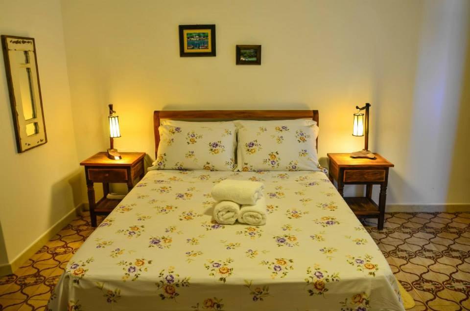 Cama o camas de una habitación en Viva Brasil Pousada