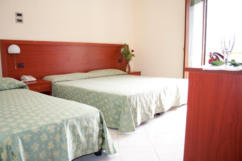 Letto o letti in una camera di Hotel Felix