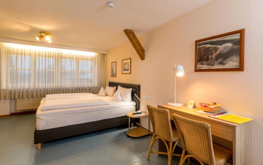 Postel nebo postele na pokoji v ubytování CityHotel Kempten