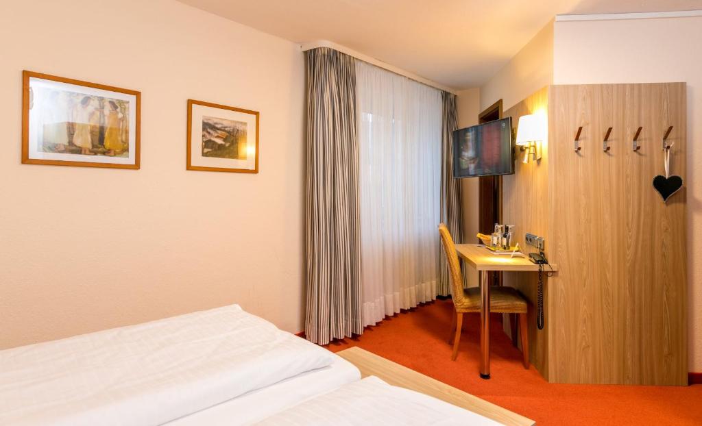 Postel nebo postele na pokoji v ubytování CityHotel Kempten