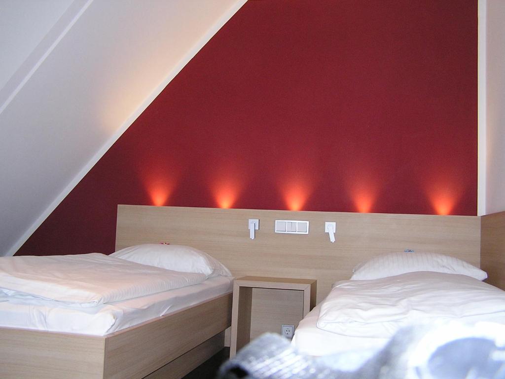 Postel nebo postele na pokoji v ubytování Hotel zur Promenade